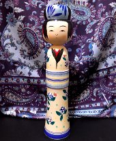 Kakizawa Yoshinobu (柿沢是伸) The mage on this elegant girl is covered in mums while the kimono is decorated in hydrangeas with little pink snails . The obi has such a beautiful stain of...