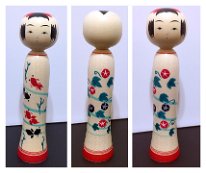 Kakizawa Yoshinobu (柿沢是伸) This Kokeshi is one of his new reverse styles where there are 2 unique designs front and back and you can turn the Kokeshi's head to make either one the front.