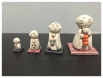 Jizo holding Kokeshi