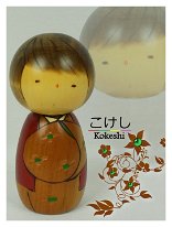 Usaburo Co. Although unsigned this doll is typical of an Usaburo Factory Kokeshi and has been attributed to Usaburo unless otherwise informed.