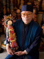 Oiran being held by her maker Sekiguchi Sansaku (関口 三作) Picture of Sekiguchi holding one of his beautiful masterpieces