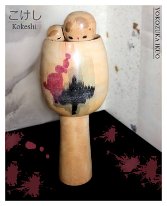 Yokozuka Ikuhō (横塚 郁芳) This Kokeshi was initially Translated to Yokuzaka Kunihiko but I recently found some more Kokeshi by the artist with the same Signature listed as Yokozuka Ikuo