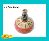 Kokeshi Games: Fortune game. Missing the spinner on top. Undetermined artist. Game of Fortune. Guess where the Kokeshi will face once you give it a good spin and see if you win!