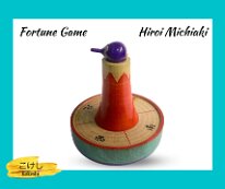 Kokeshi Games: Mount Fuji by Hiroi Michiaki The eggplant top does not appear to be original to the piece.